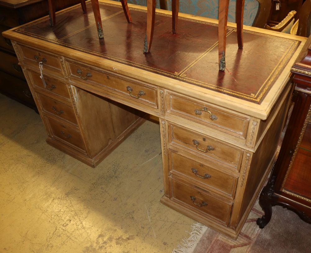 An early 20th century pine pedestal desk, W.130cm, D.63cm, H.73cm